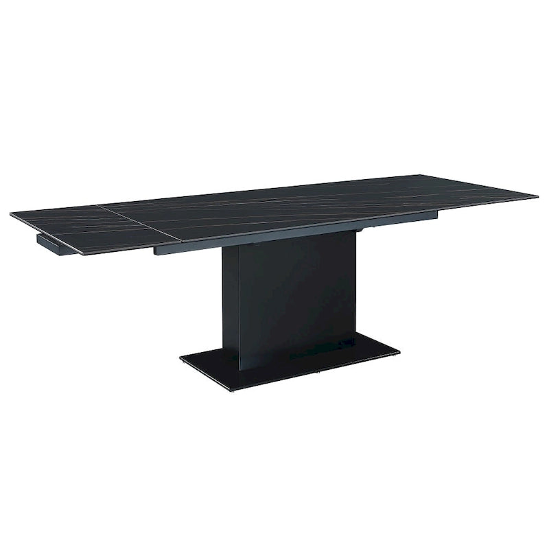 Table extensible en pierre frittée avec piétement en bois et base en verre