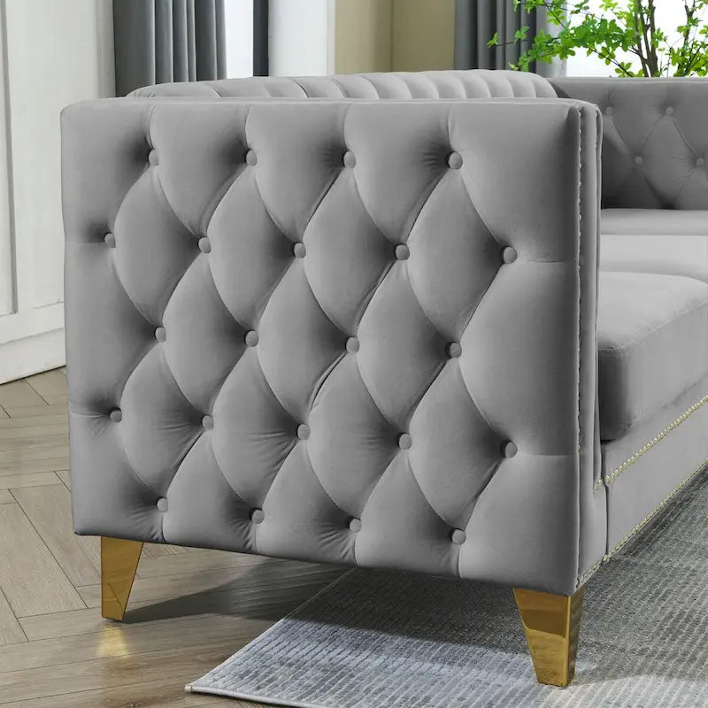 Canapé moderne en velours avec capitonnage et pieds en métal